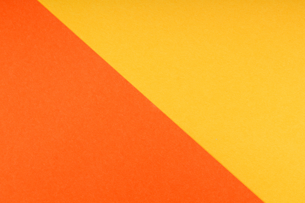 Orange and Yellow Paper Connected Diagonally 